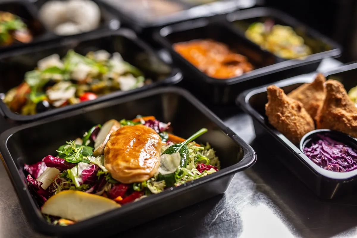 Restaurant kitchen pass with delivery orders ready
